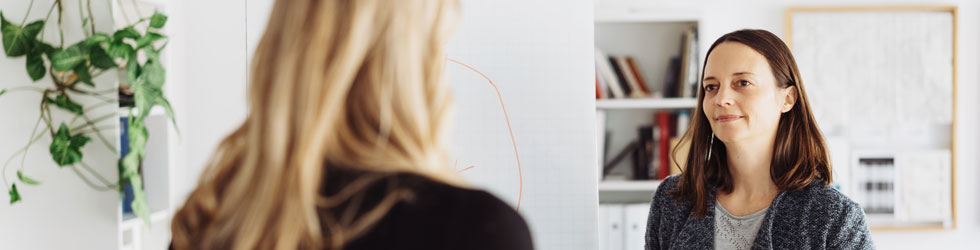 women coworkers engaged in discussion